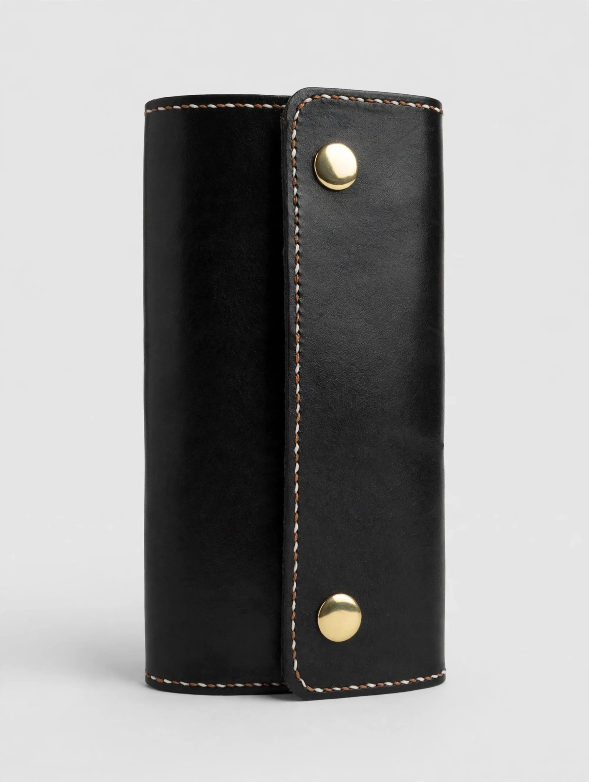 Black leather clutch with brass snaps